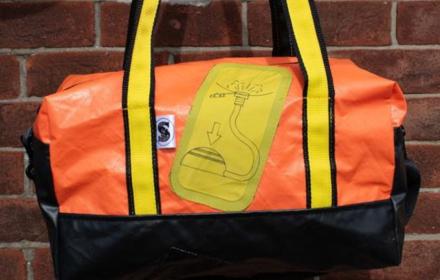 Opposite view, orange with raft feature and yellow straps